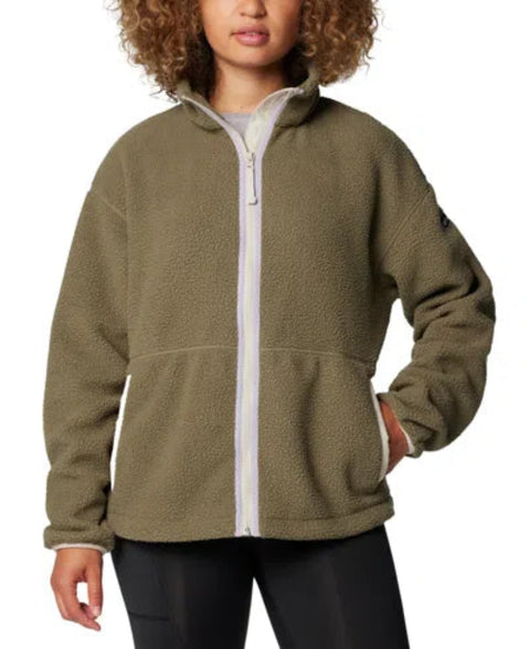 Person wearing a green fleece jacket with a white zipper on a white background