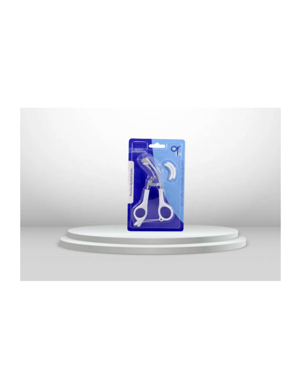 Precision eyelash curler by Or Bleu, displayed in an upright position with the product visible inside its packaging.