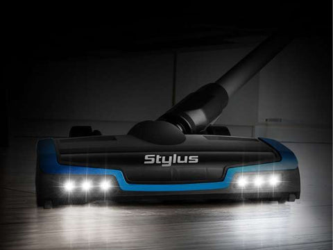 Stylus robot vacuum cleaner on a dark floor