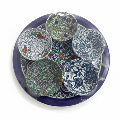 Set of colorful ceramic plates on a white background