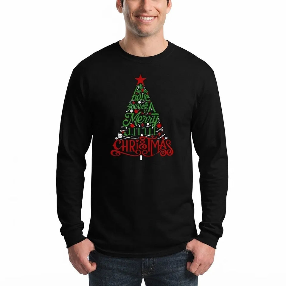 A man wearing a black long-sleeve crewneck t-shirt with a graphic of a Christmas tree made of the words 'Merry Merry Merry' and 'CHRISTMAS' in red and green, paired with blue jeans against a plain white background.