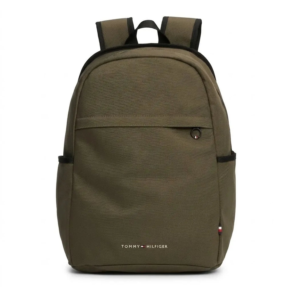 An olive green Tommy Hilfiger backpack with black trim, side pockets, and a front zippered pocket, shown against a plain white background.