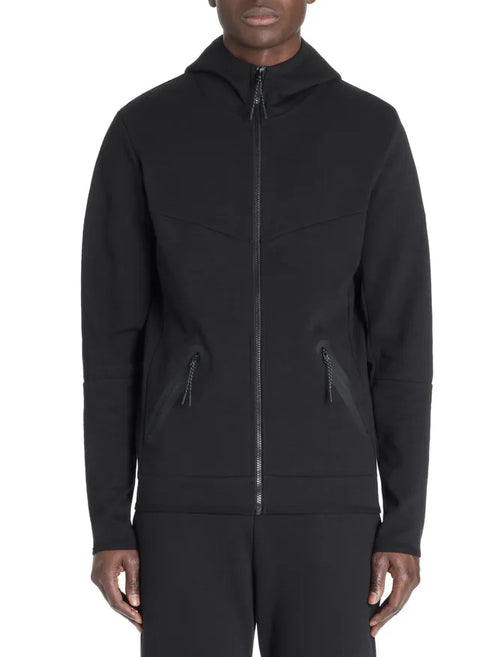 Black hooded jacket worn by a person on a white background