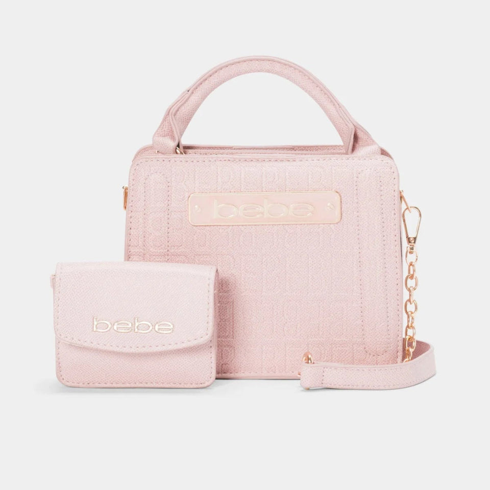 A light pink textured leather handbag set with a matching small pouch, featuring a top handle, shoulder strap, and gold-tone chain detail on a light gray background.