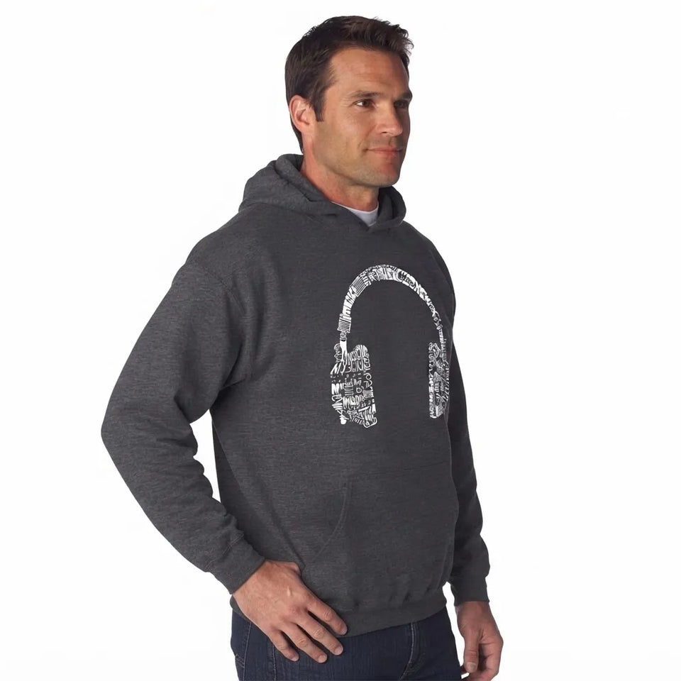A man wearing a dark gray heather pullover hoodie with a white headphone graphic on the chest, posed against a solid white background.