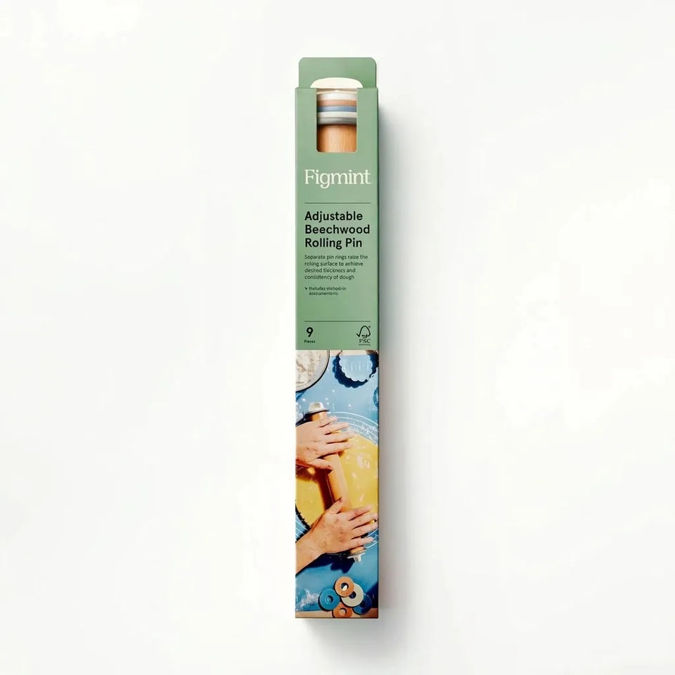 Figmint Adjustable Beechwood Rolling Pin in its original green cardboard packaging, shown vertically against a clean white background.