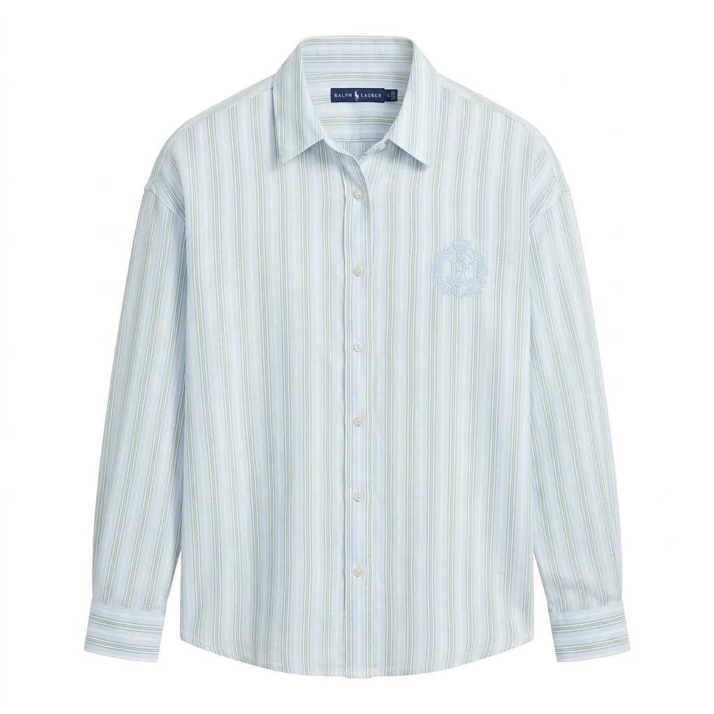 A light blue and white vertically striped long-sleeve button-down shirt with a subtle embroidered crest on the left chest, shown on a plain white background.
