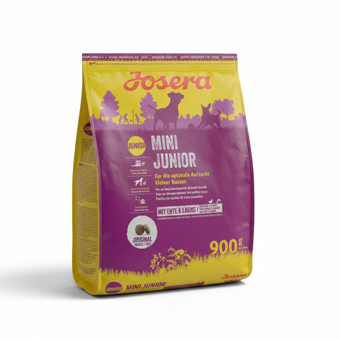 Josera Mini Junior dog food packaging on a concrete surface
