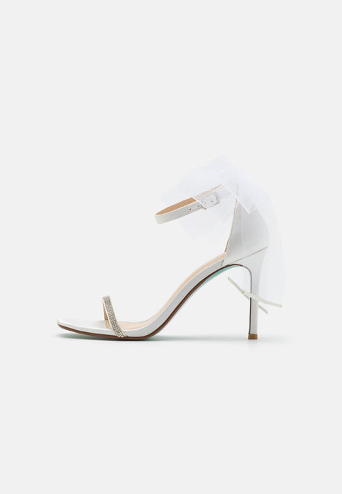 White high-heeled sandal on a white background