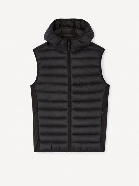 Black puffer vest on a white background
