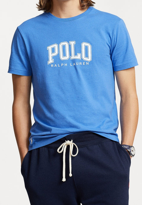 Person wearing a blue Polo Ralph Lauren t-shirt and navy pants on a white background