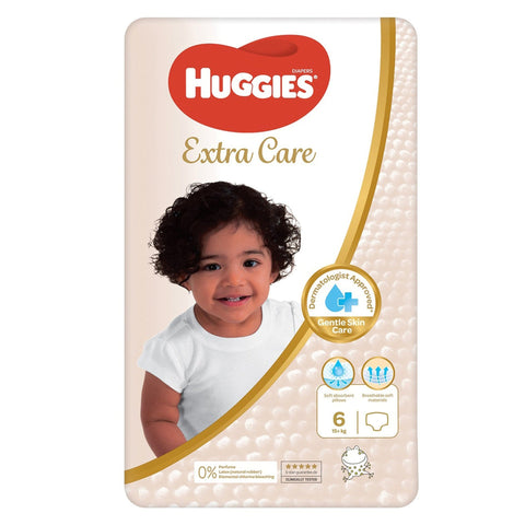 Huggies Extra Care diaper package with a child on the front, featuring the Huggies logo.