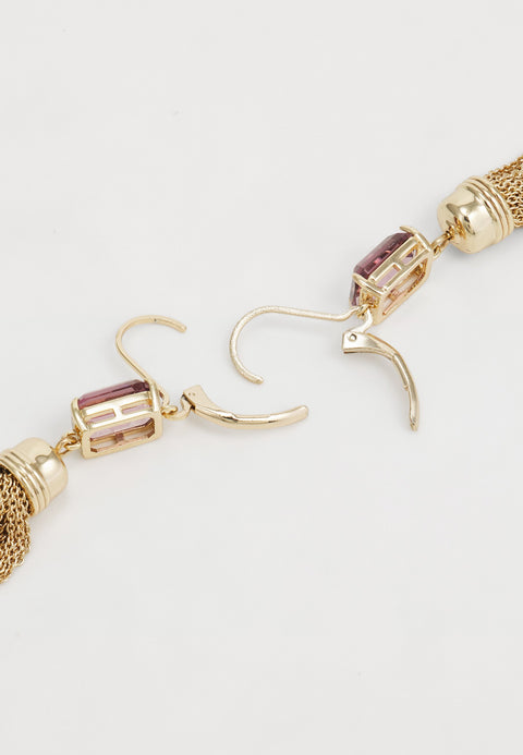 Gold hoop earrings with pink gemstones on a light gray background
