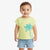 A toddler wearing a light yellow-green short-sleeve t-shirt with a turquoise palm tree graphic, paired with light-wash denim shorts, standing against a plain white background.