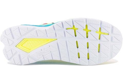 Close-up of a shoe sole with yellow accents on a white background