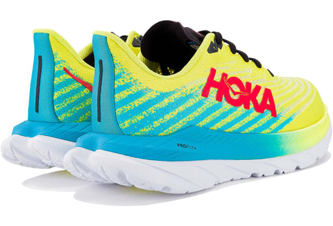 Pair of Hoka running shoes with bright yellow and blue design on a white background