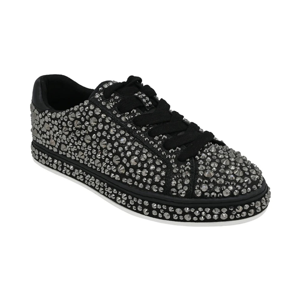A black low-top sneaker covered in silver rhinestones, featuring black laces and a black sole with a white edge, shown against a plain white background.