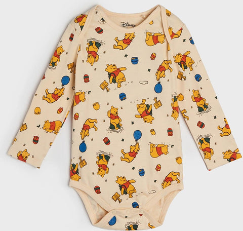 Baby onesie with Winnie the Pooh pattern on a white background