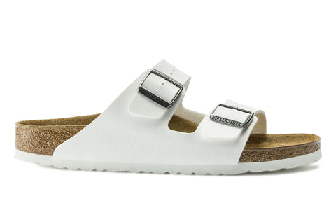White sandal with cork sole on a white background