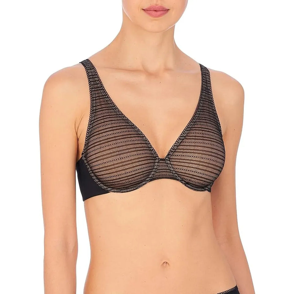A woman wearing a black sheer mesh underwire bra with a crossover front and wide shoulder straps, shown against a plain white background.