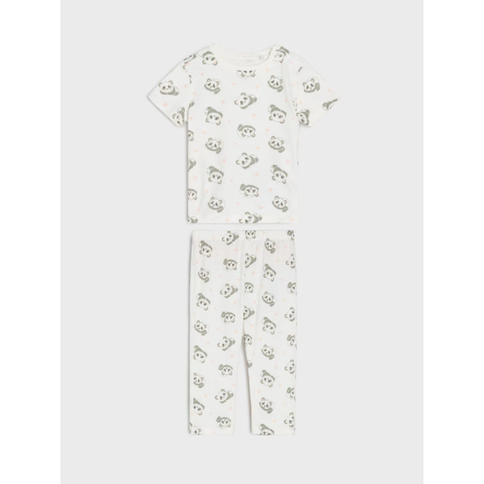 A two-piece baby pajama set featuring a short-sleeve top and matching pants, both in an off-white fabric with a repeating print of cute black and gray cartoon panda faces, shown against a light gray background.