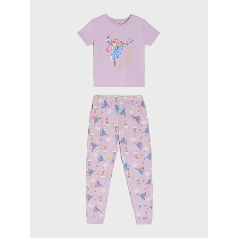 A two-piece children's pajama set in light purple, featuring a short-sleeve top with a fairy graphic and matching pants with an all-over fairy print, displayed flat against a light gray background.