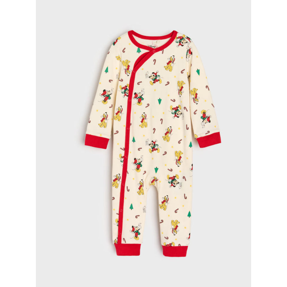 A baby's long-sleeve footless pajama romper in cream with a red snap closure, red trim, and a colorful cowboy print, shown on a light gray background.