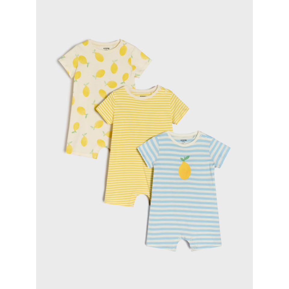 Three baby short-sleeve romper t-shirts arranged in a fan shape on a light gray background. The top-left romper is cream with a yellow lemon print.