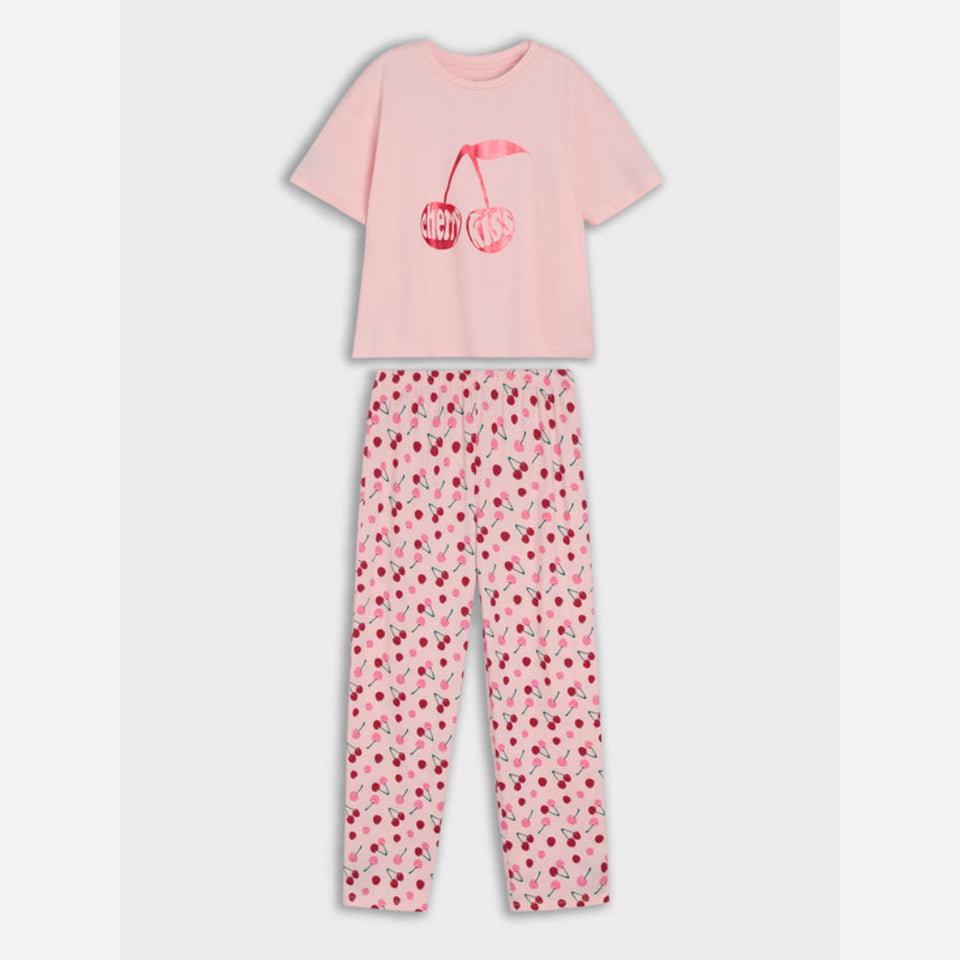A two-piece children's pajama set featuring a light pink short-sleeve t-shirt with a cherry graphic and matching patterned pants.
