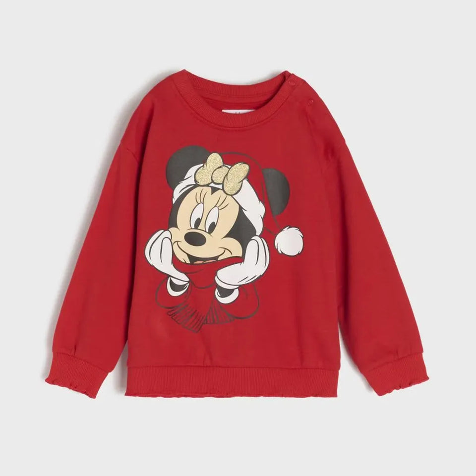 A red long-sleeve crewneck sweatshirt featuring a large graphic of Minnie Mouse wearing a Santa hat on the front, displayed against a light gray background.