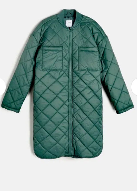 Green quilted coat on a white background