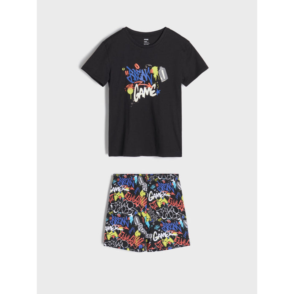 A two-piece kids' outfit set featuring a black short-sleeve t-shirt with a colorful graffiti-style 'BREATHE' graphic on the chest, and matching black shorts with a vibrant multicolor graffiti pattern.