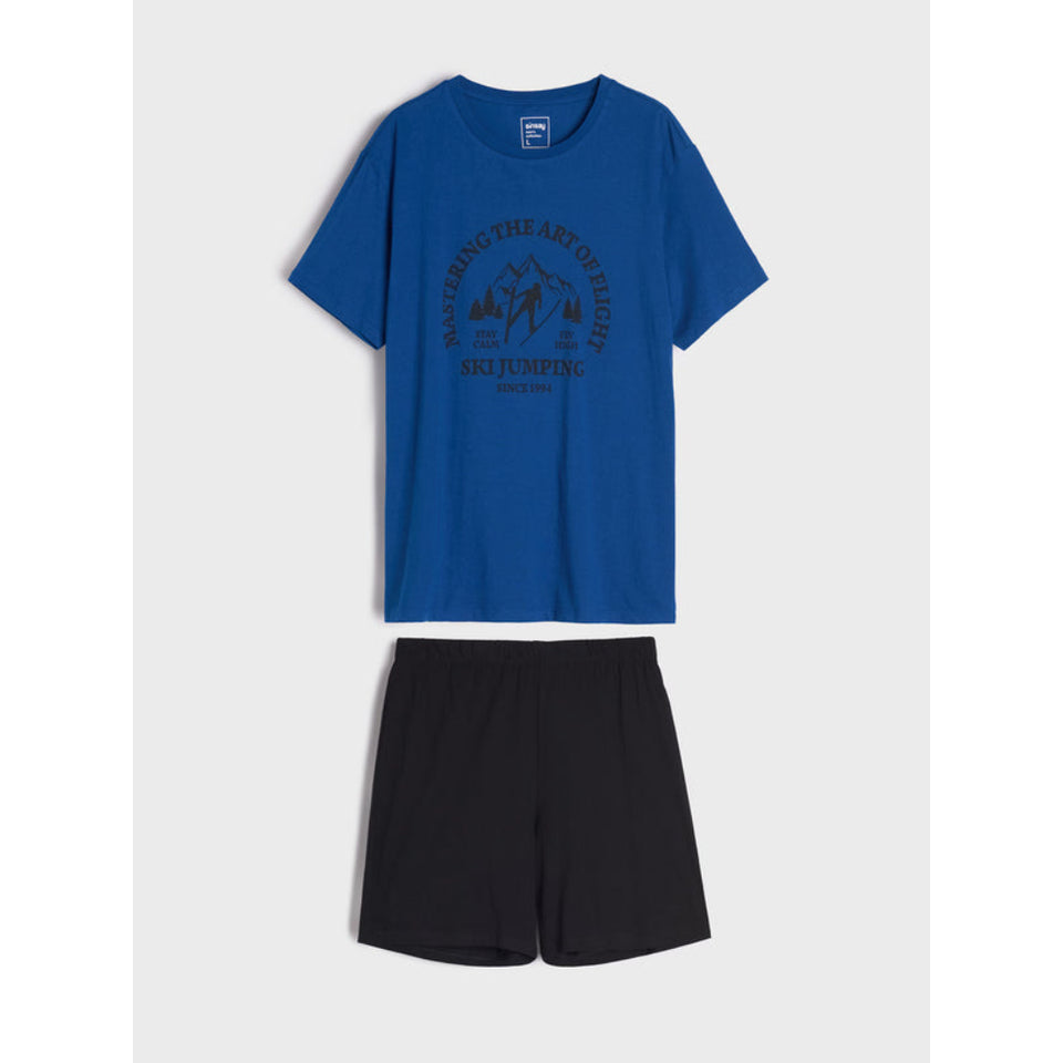 A two-piece clothing set featuring a royal blue short-sleeve t-shirt with a dark graphic print and matching black shorts, displayed against a light gray background.