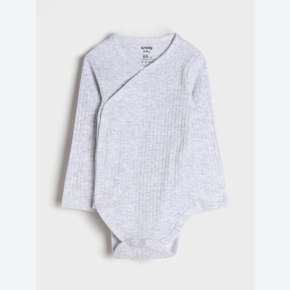 A light gray ribbed long-sleeve baby bodysuit with an asymmetrical wrap design, laid flat against a light gray background.