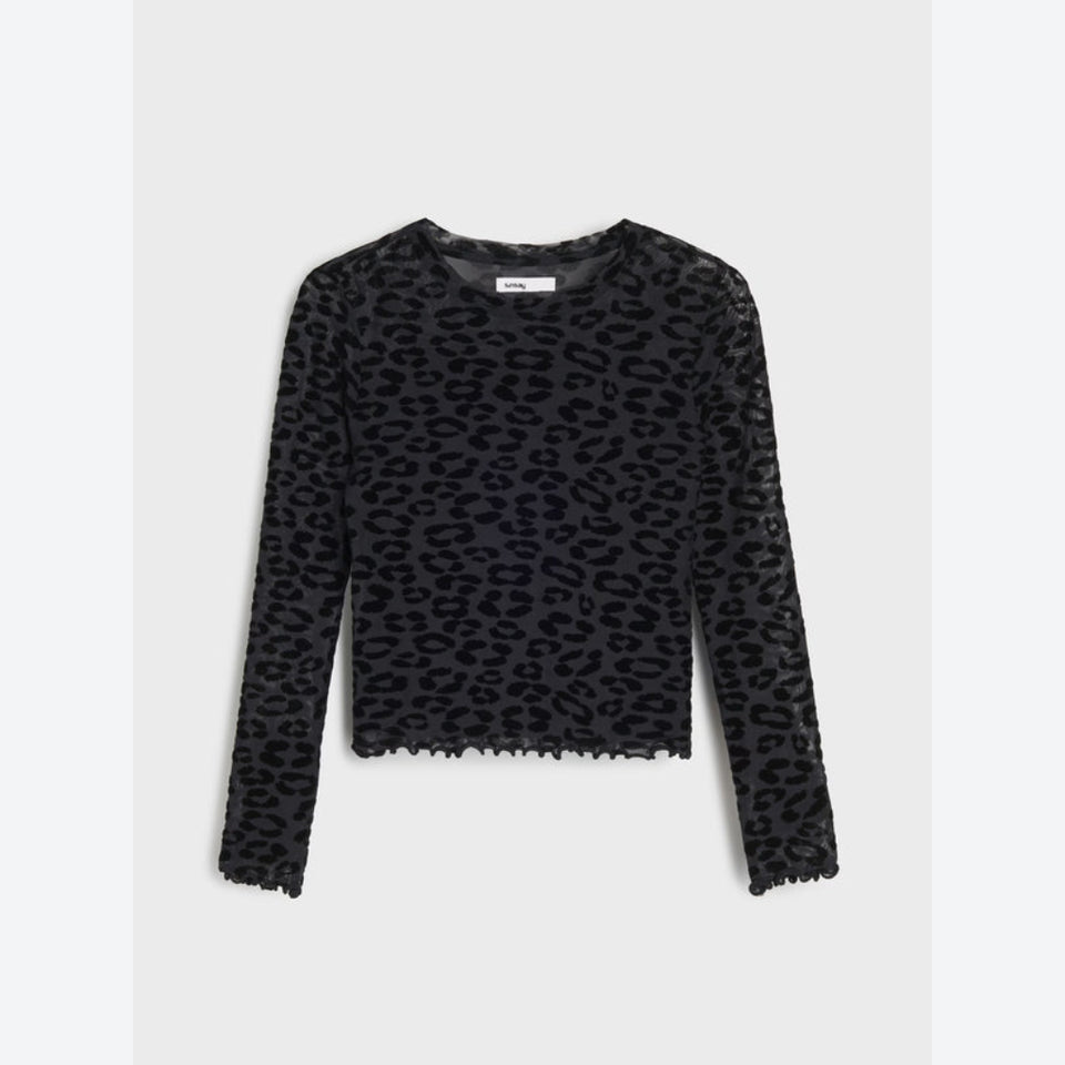 A black long-sleeve crop top with an allover leopard print pattern and a scalloped hem, displayed flat against a light gray background.