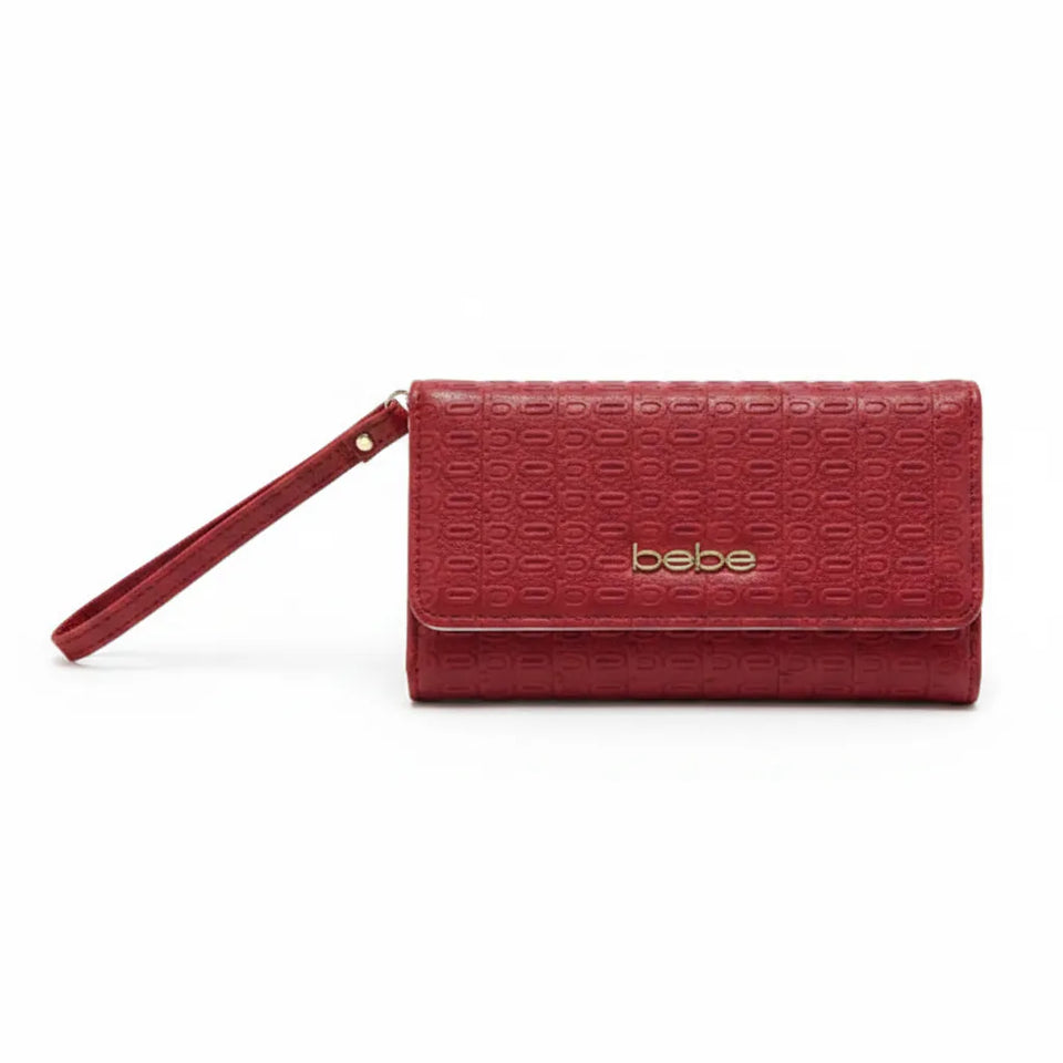 A red textured leather wristlet clutch with a matching wrist strap and a gold-tone 'bebe' logo on the front, shown against a plain white background.