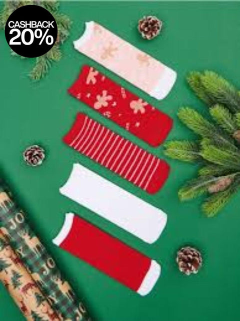 Red and white Christmas-themed socks on a green background with pine branches and pinecones.