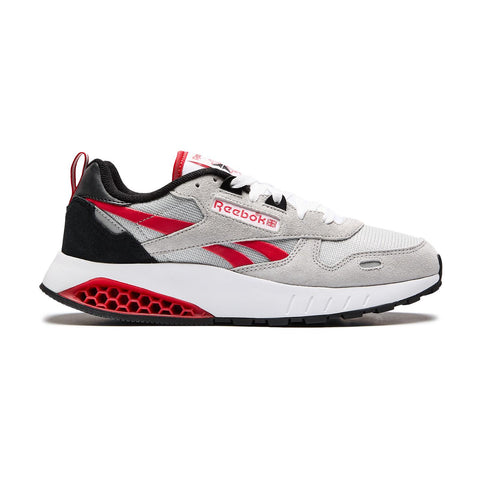 Reebok sneaker with gray, red, and black design on a white background