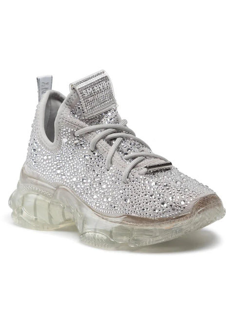 Silver sneaker with rhinestone details on a white background