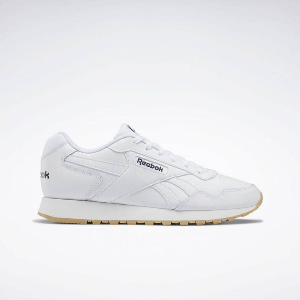 White Reebok sneaker on a light gray background