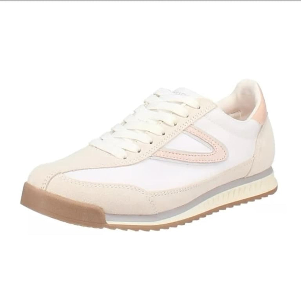 White sneaker with a brown sole on a white background