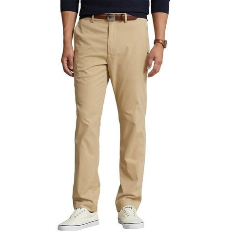 Beige pants worn by a person on a white background