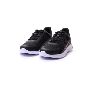 A pair of black athletic sneakers with white soles and subtle red accents on the side, displayed against a clean white background.