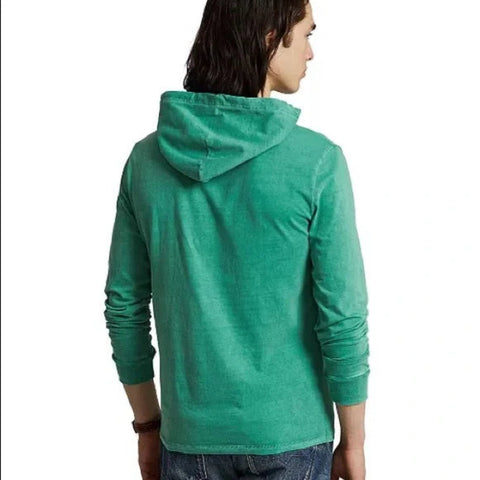 Person wearing a green hoodie from behind on a white background