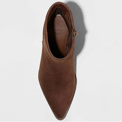 Brown suede ankle boot on a light gray background