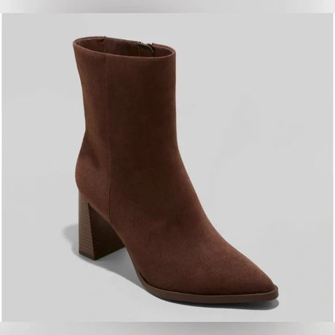 Brown ankle boot on a light gray background