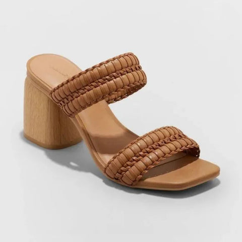 Tan woven sandal with wooden block heel on a light gray background