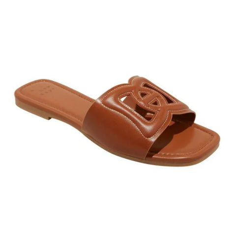 Brown sandal with a decorative strap on a white background