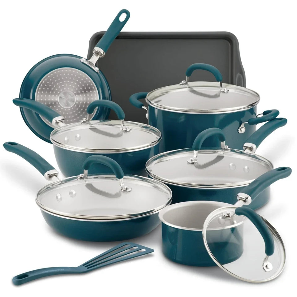 A 12-piece cookware set in teal with stainless steel interiors and lids, including multiple pots, pans, a deep skillet, a colander, a baking pan, and a spatula, arranged on a white background.