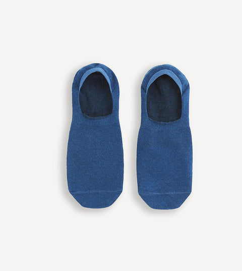 Pair of blue no-show socks on a white background